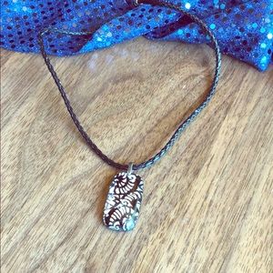 Glass pendant on leather chain